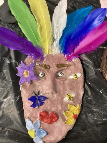 Clay creation - Human face with feathered headdress 